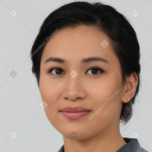 Joyful asian young-adult female with medium  brown hair and brown eyes