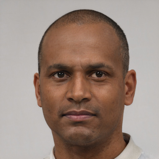 Neutral latino adult male with short  brown hair and brown eyes