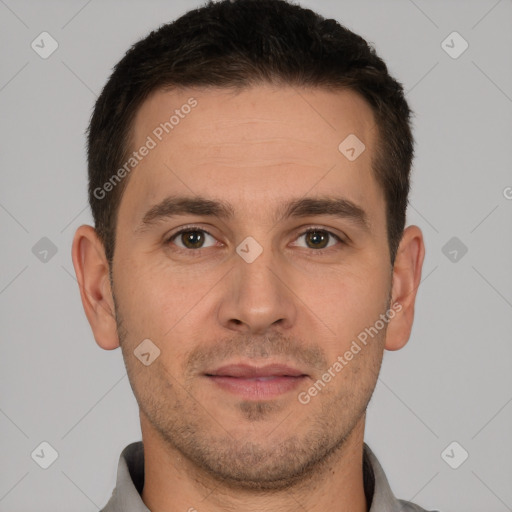 Joyful white young-adult male with short  brown hair and brown eyes