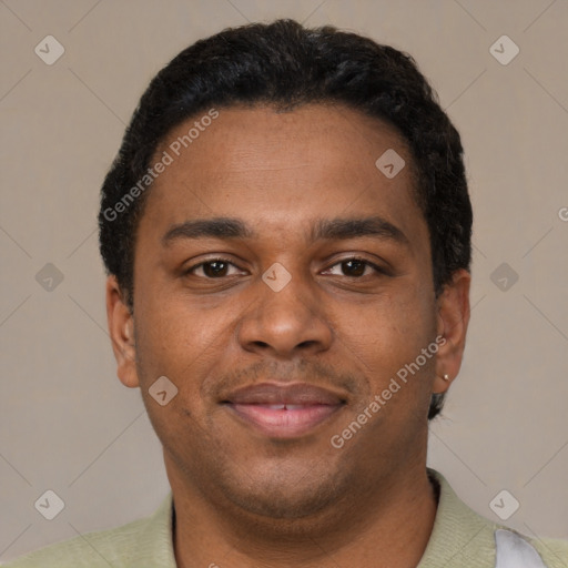 Joyful black young-adult male with short  brown hair and brown eyes