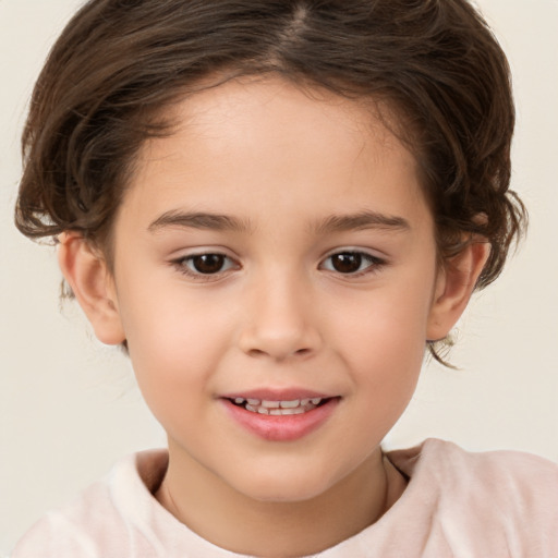 Joyful white child female with short  brown hair and brown eyes