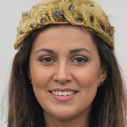 Joyful white adult female with long  brown hair and brown eyes