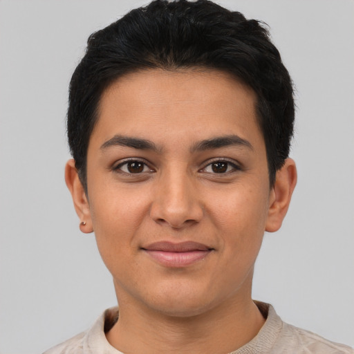 Joyful latino young-adult female with short  black hair and brown eyes