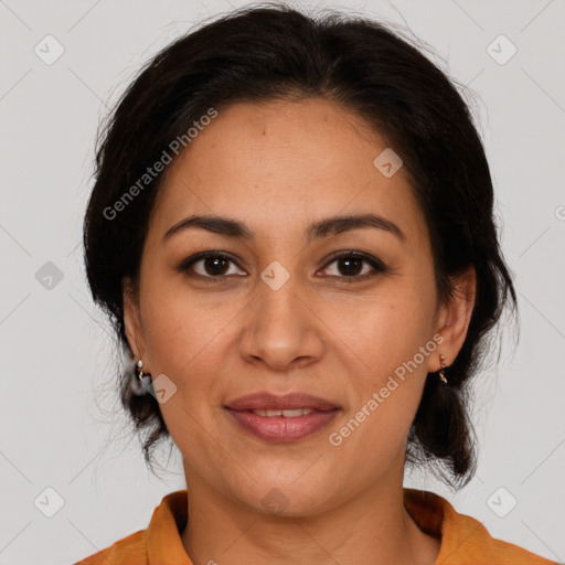 Joyful latino adult female with medium  brown hair and brown eyes