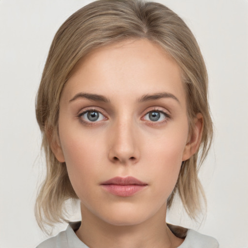 Neutral white young-adult female with medium  brown hair and grey eyes