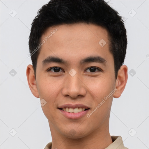 Joyful latino young-adult male with short  brown hair and brown eyes