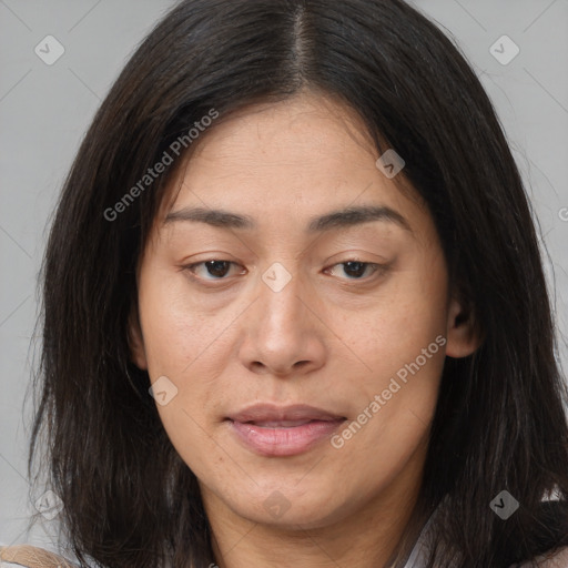 Joyful asian young-adult female with long  brown hair and brown eyes