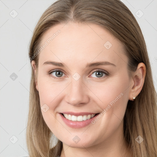 Joyful white young-adult female with long  brown hair and grey eyes