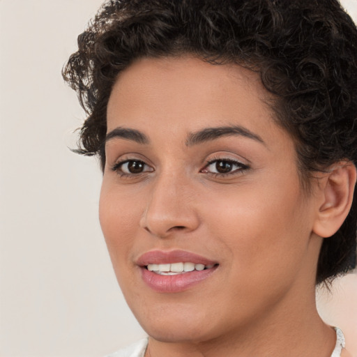 Joyful white young-adult female with short  brown hair and brown eyes