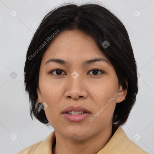 Joyful asian young-adult female with medium  brown hair and brown eyes