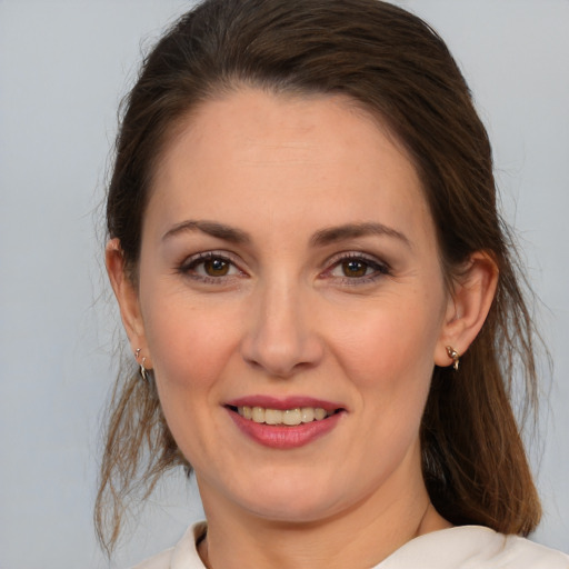 Joyful white young-adult female with medium  brown hair and brown eyes