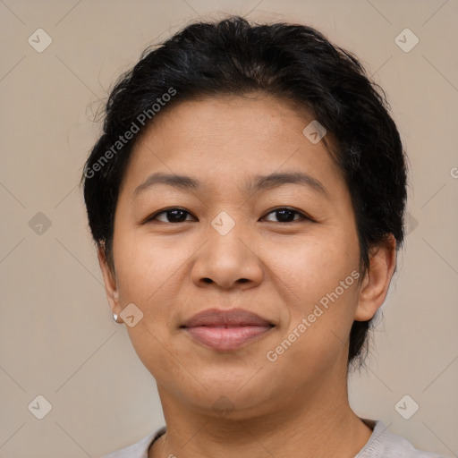 Joyful latino young-adult female with short  brown hair and brown eyes