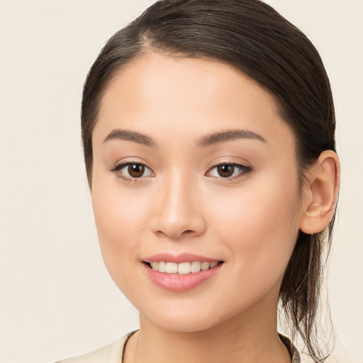 Joyful white young-adult female with long  brown hair and brown eyes