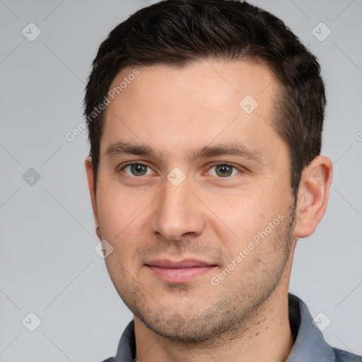 Joyful white young-adult male with short  brown hair and brown eyes