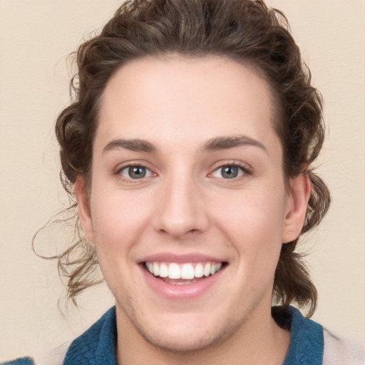 Joyful white young-adult female with medium  brown hair and blue eyes