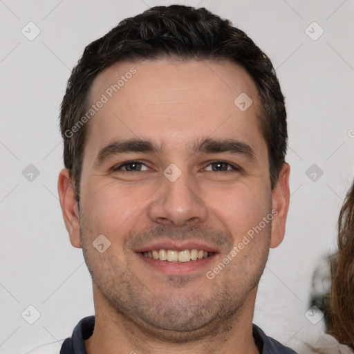 Joyful white young-adult male with short  brown hair and brown eyes