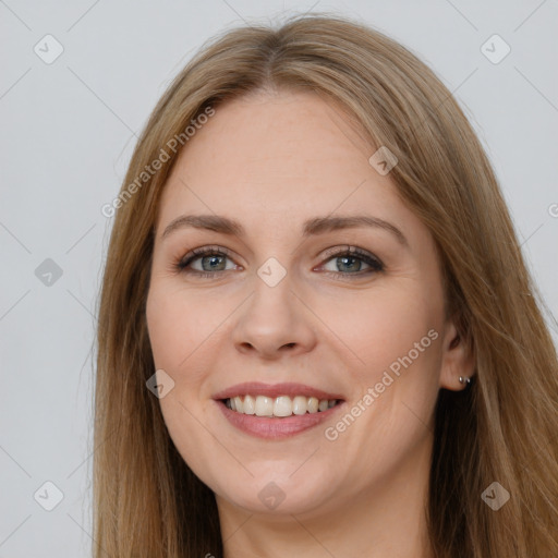 Joyful white young-adult female with long  brown hair and brown eyes