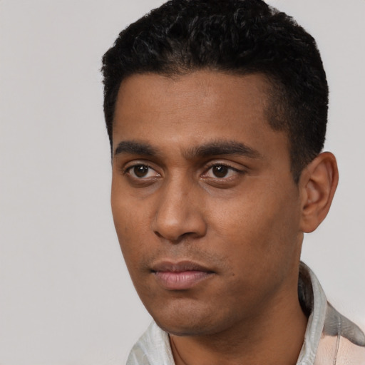 Neutral latino young-adult male with short  black hair and brown eyes