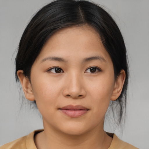 Joyful asian young-adult female with medium  brown hair and brown eyes
