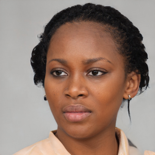 Neutral black young-adult female with medium  black hair and brown eyes