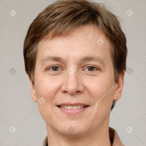 Joyful white adult male with short  brown hair and grey eyes