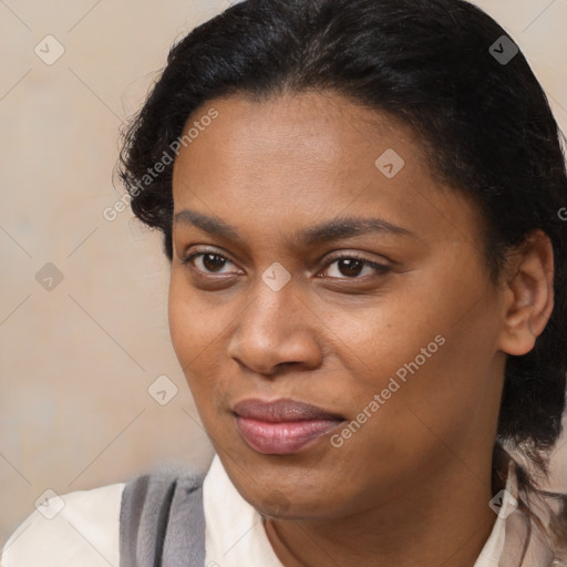 Joyful black young-adult female with medium  brown hair and brown eyes