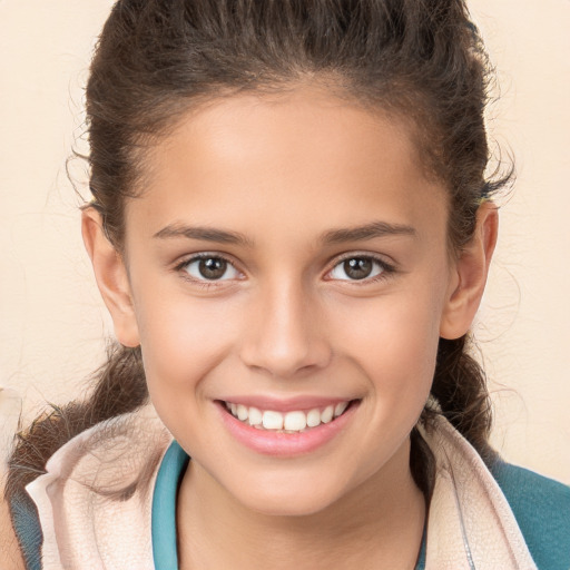 Joyful white child female with short  brown hair and brown eyes