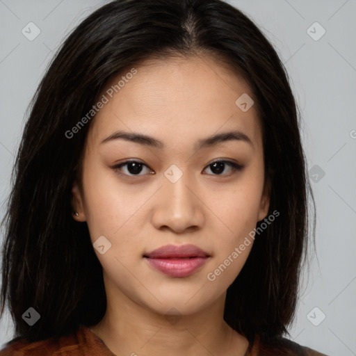 Joyful asian young-adult female with long  brown hair and brown eyes