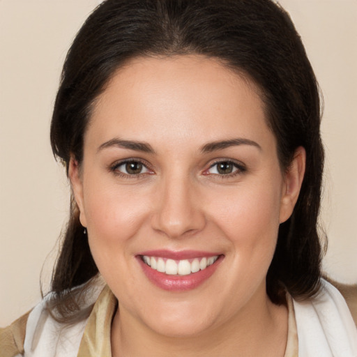 Joyful white young-adult female with medium  brown hair and brown eyes