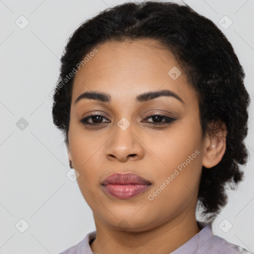 Joyful latino young-adult female with short  black hair and brown eyes