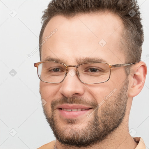 Joyful white adult male with short  brown hair and brown eyes