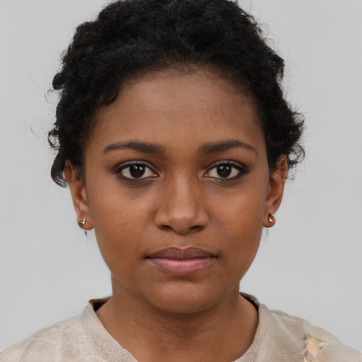 Neutral black young-adult female with short  black hair and brown eyes