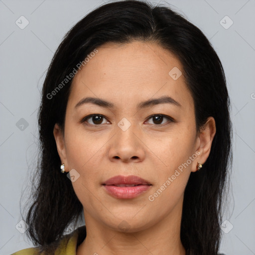 Joyful asian adult female with medium  brown hair and brown eyes