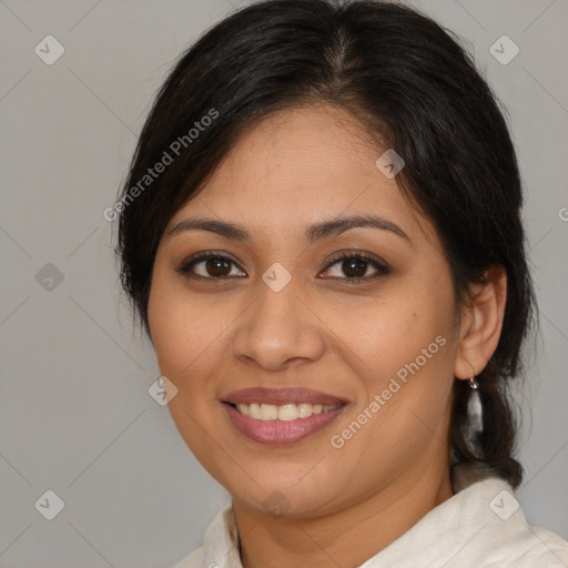 Joyful latino young-adult female with medium  brown hair and brown eyes