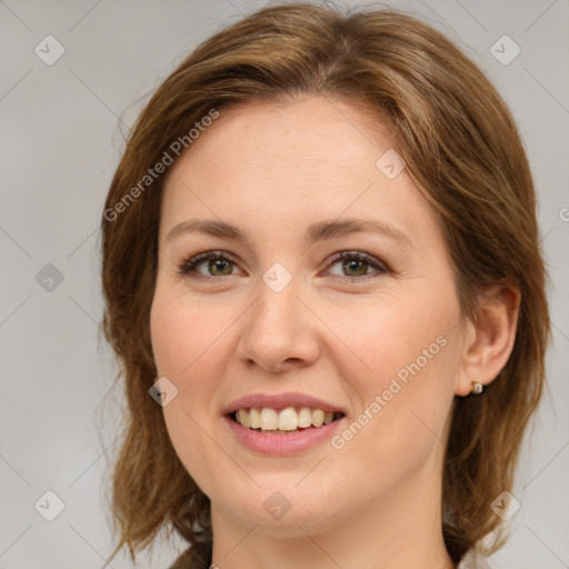 Joyful white young-adult female with medium  brown hair and green eyes