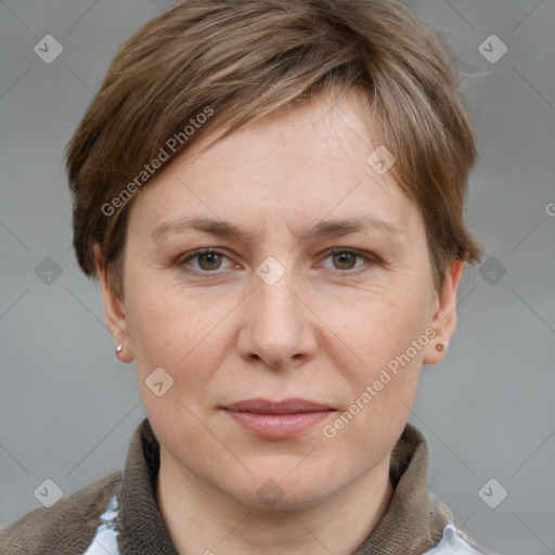 Joyful white adult female with short  brown hair and grey eyes