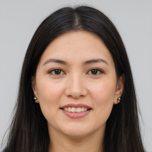 Joyful white young-adult female with long  brown hair and brown eyes