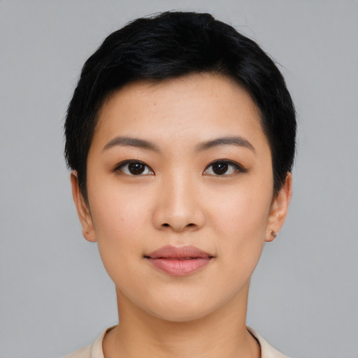 Joyful asian young-adult female with short  black hair and brown eyes