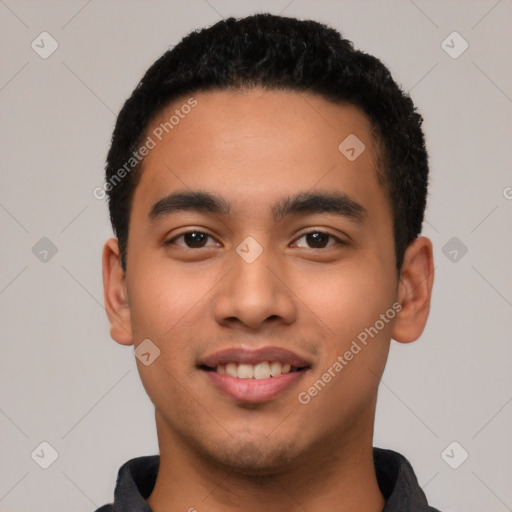 Joyful latino young-adult male with short  black hair and brown eyes