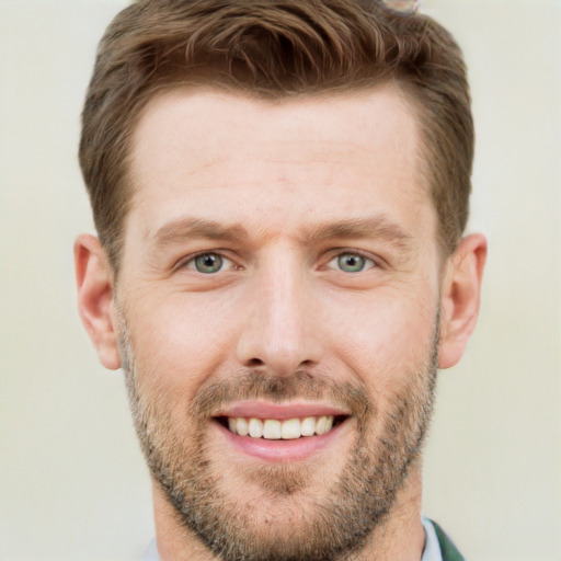 Joyful white adult male with short  brown hair and brown eyes