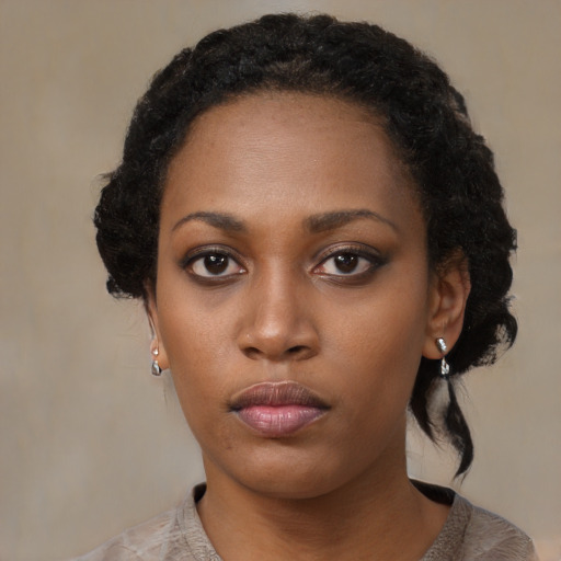 Neutral black young-adult female with medium  black hair and brown eyes