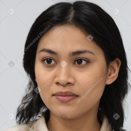 Joyful asian young-adult female with medium  black hair and brown eyes