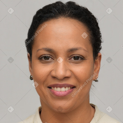 Joyful latino adult female with short  brown hair and brown eyes