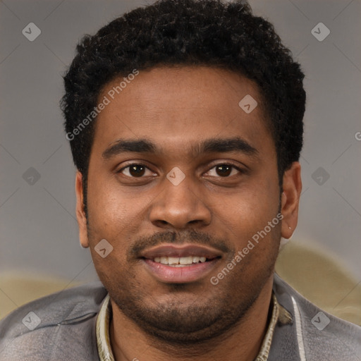 Joyful black young-adult male with short  black hair and brown eyes
