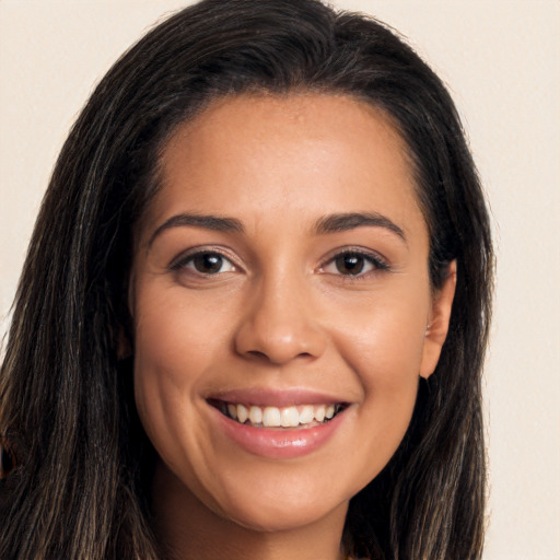 Joyful white young-adult female with long  brown hair and brown eyes