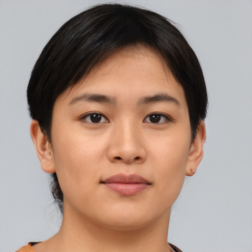 Joyful asian young-adult female with short  brown hair and brown eyes
