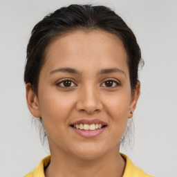 Joyful white young-adult female with medium  brown hair and brown eyes