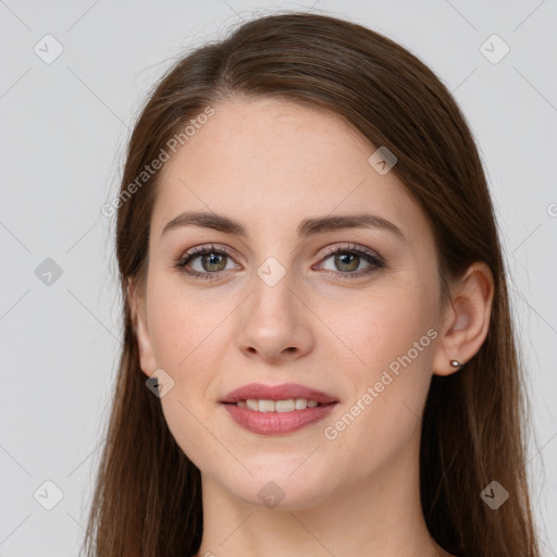 Joyful white young-adult female with long  brown hair and grey eyes