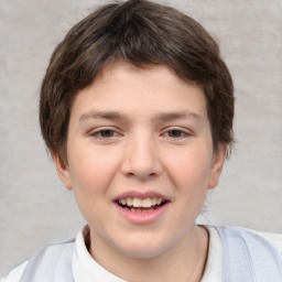 Joyful white child male with short  brown hair and brown eyes