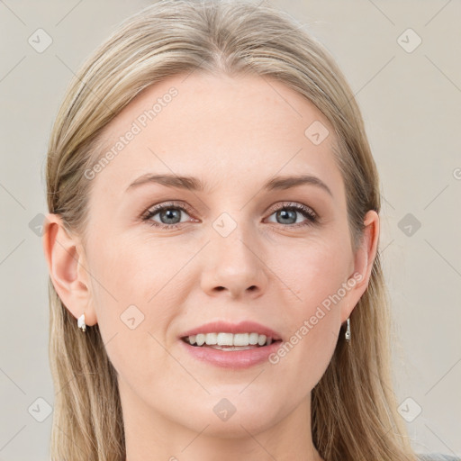 Joyful white young-adult female with long  brown hair and blue eyes